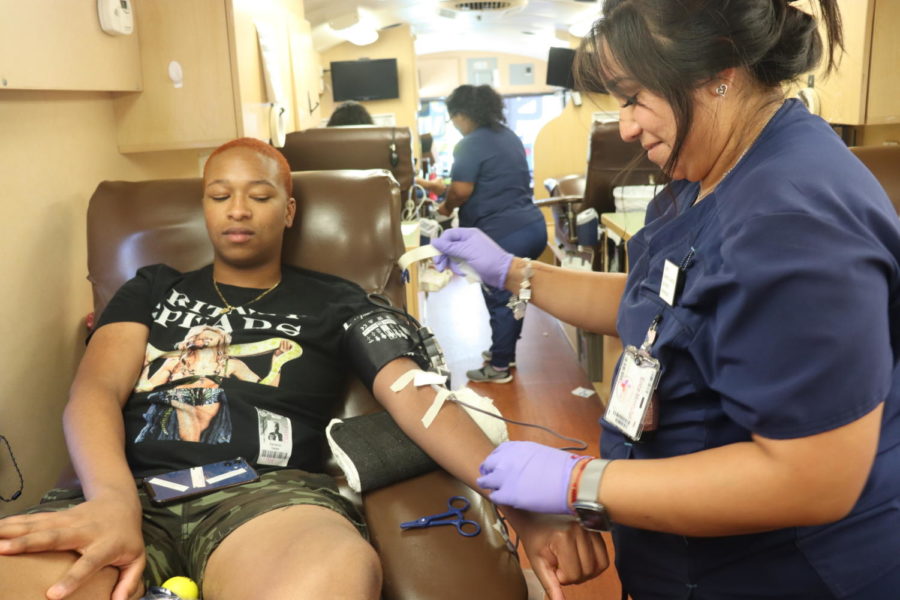 File photo: Senior Cameron Carter watches as the nurse from the Gulf Coast Regional Blood Center takes his blood at last years fall blood drive.