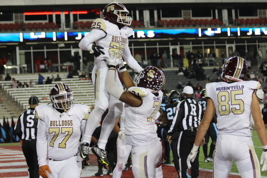 Bulldogs celebrate a big win at TDECU field against the Shadow Creek Sharks.