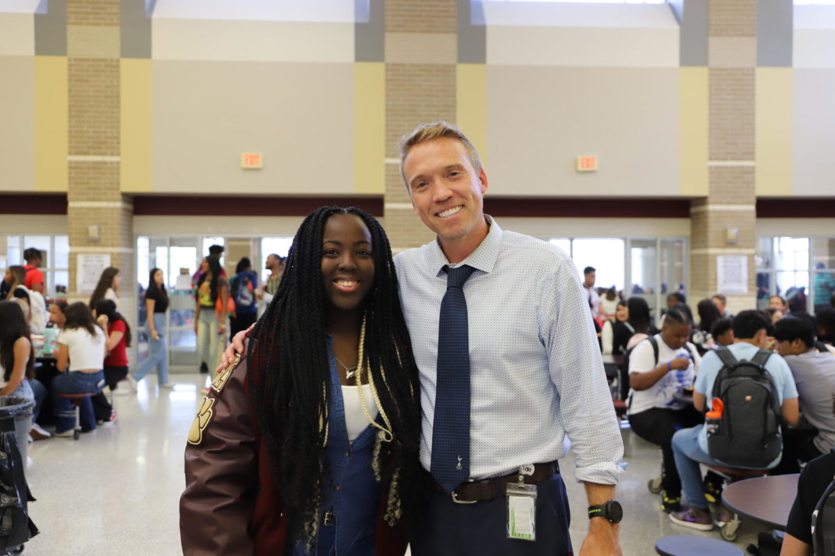 Dr. Matthew Mahony poses with junior Jamecia Fields on the first day of school.