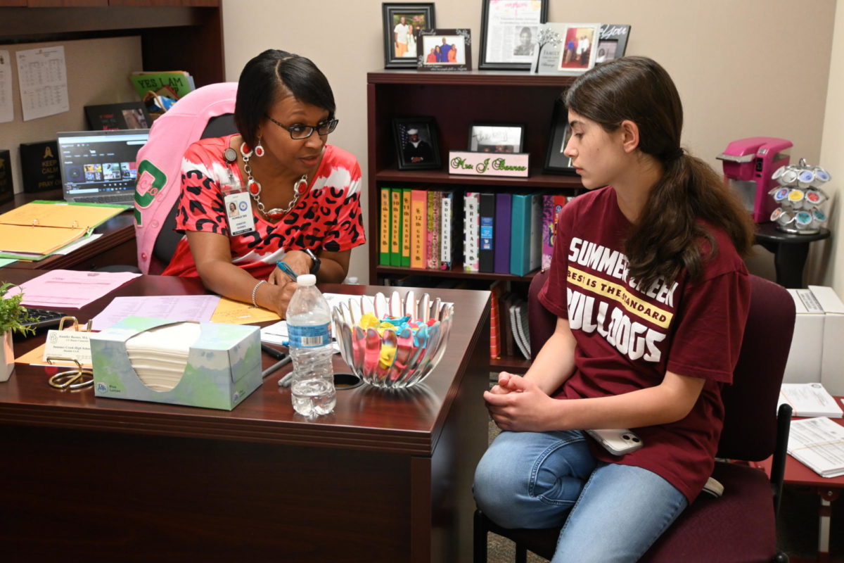 Ms. Barnes meets with a student.