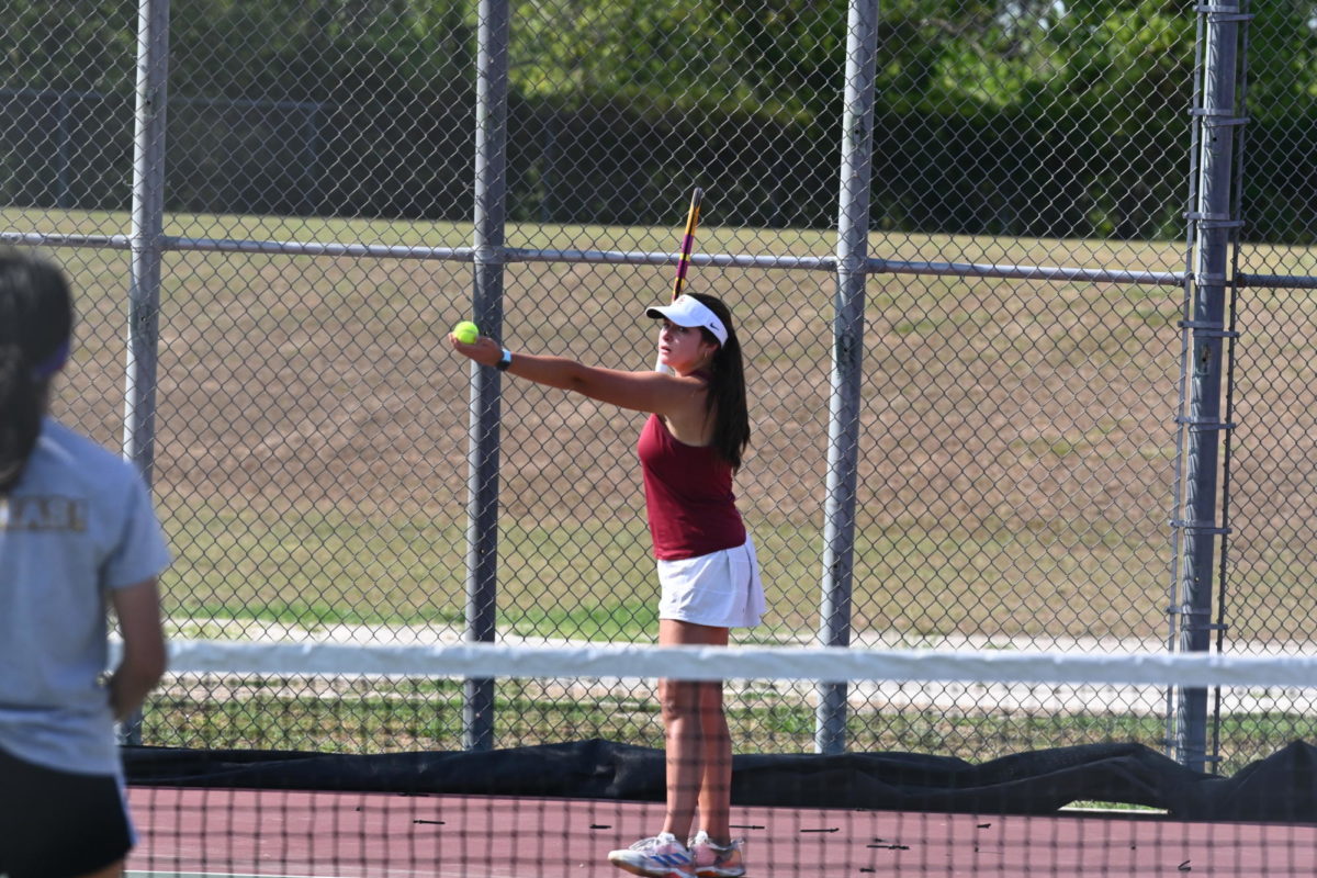 SCHS Tennis Team serves during their match against Glena Park