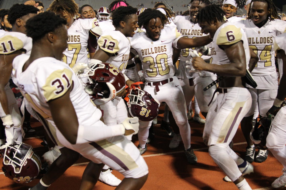 Bulldogs celebrate their road win against Clear Falls.