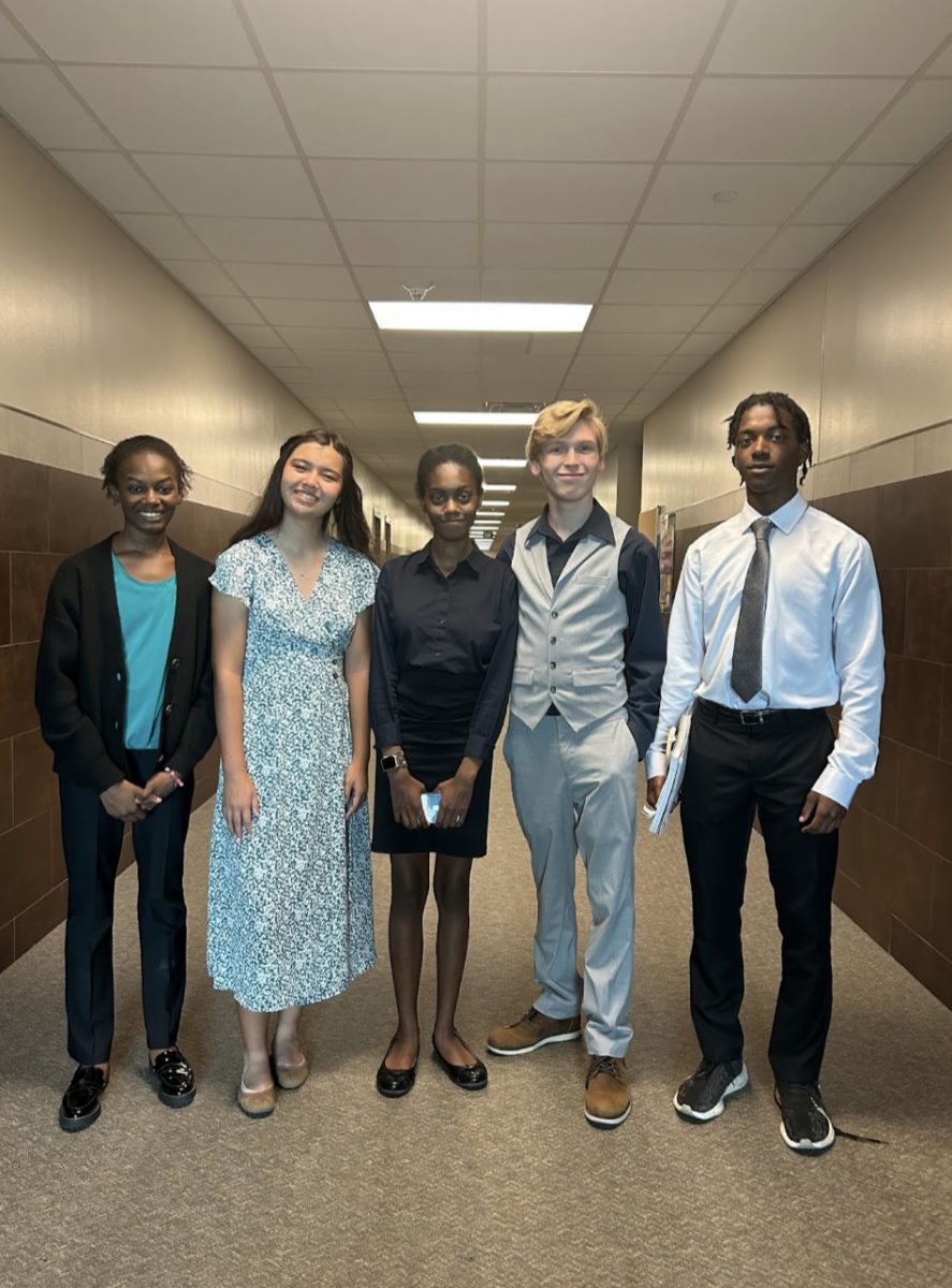 Debate Officers pose for a picture before their mock tournament 