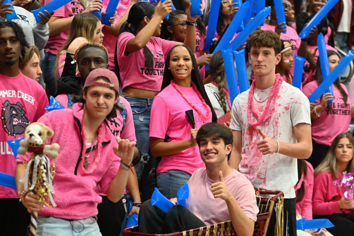 Seniors pose during Pink Out Pep Rally 