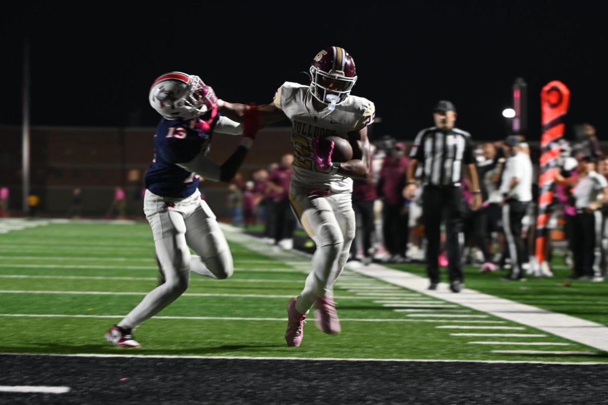 Senior Lloyd Avant stiff-arms Atascocita defender for a touchdown 