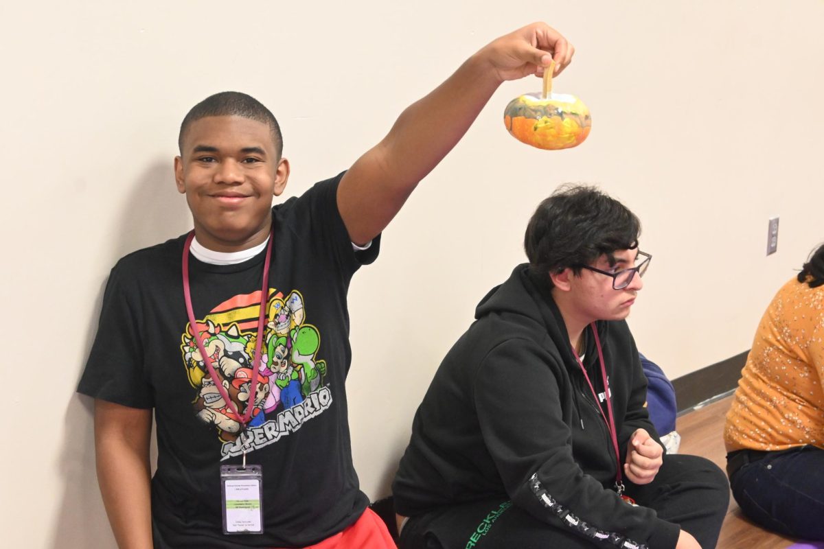 Paw pals members paint pumpkins 