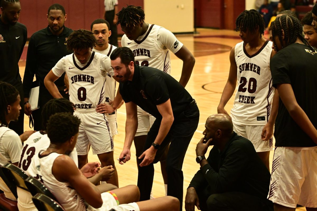 Coach Croy guides his team during the timeout 