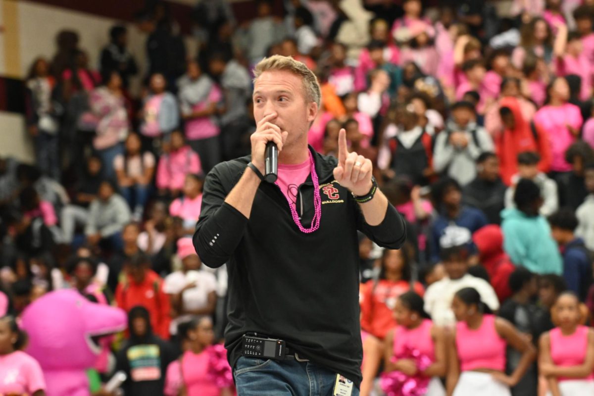 Dr. Matthew Mahony leads the class chants during the Pink Out Pep Rally on Nov. 3.