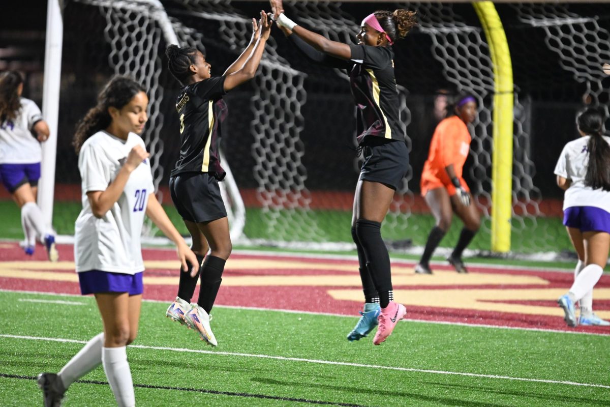 Senior Sohana Spencer celebrates on the field after she scores her 100th goal.