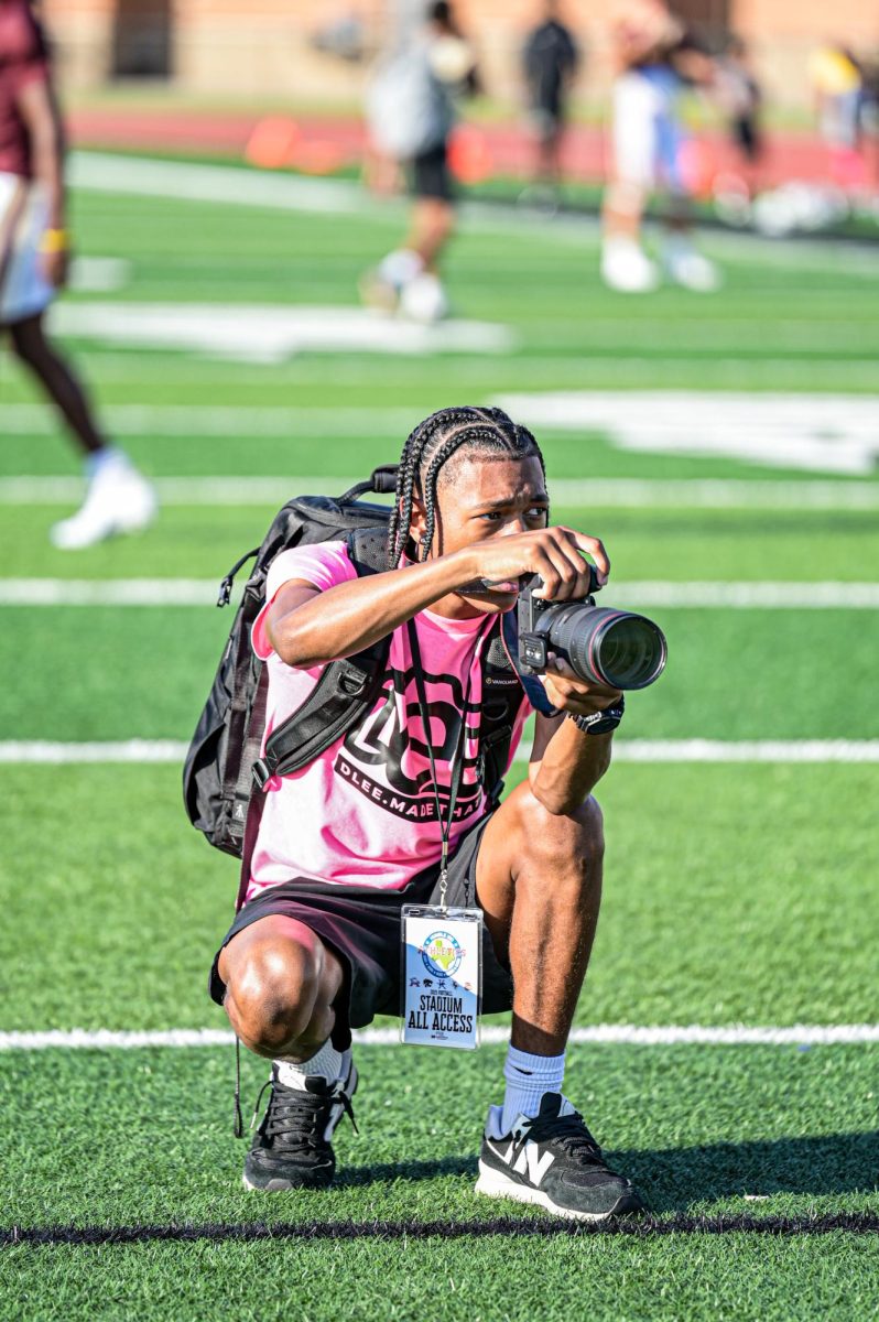 Senior Desmond Lee takes warm-up photos ahead of the Atascocita game on Oct. 3.