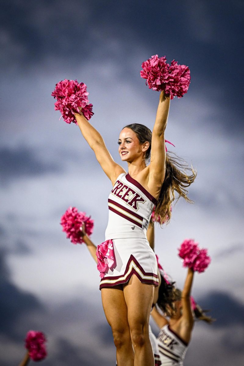 Senior Kinsley Mollohan cheers at the Humble game on Oct. 24.