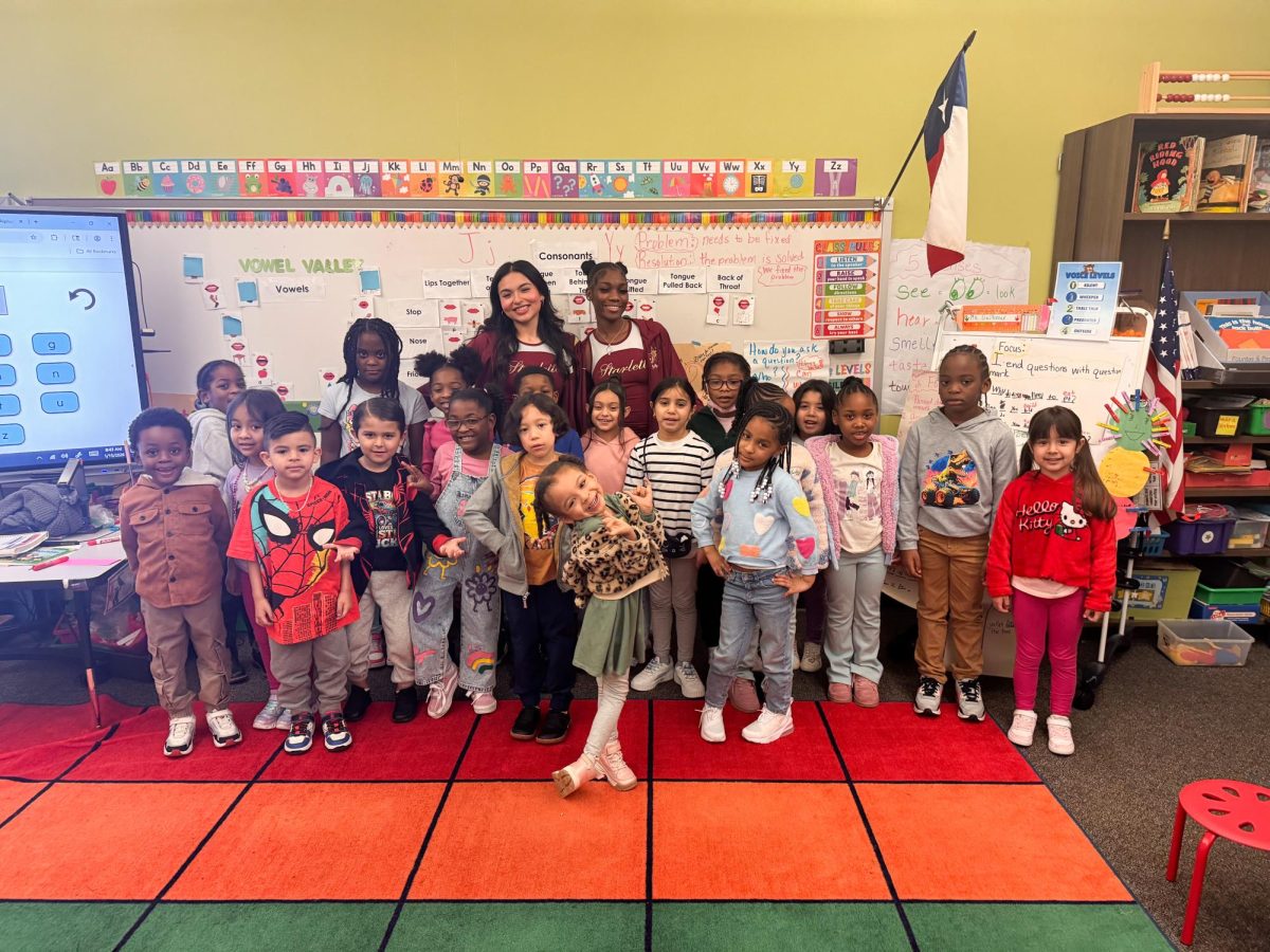 Senior Starlette officers Clarissa Lozano and JeNyah Norris read to the Elementary students.