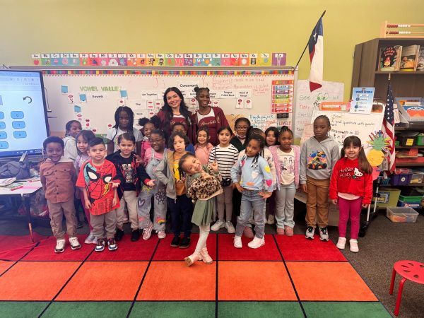 Senior Starlette officers Clarissa Lozano and JeNyah Norris read to the Elementary students.