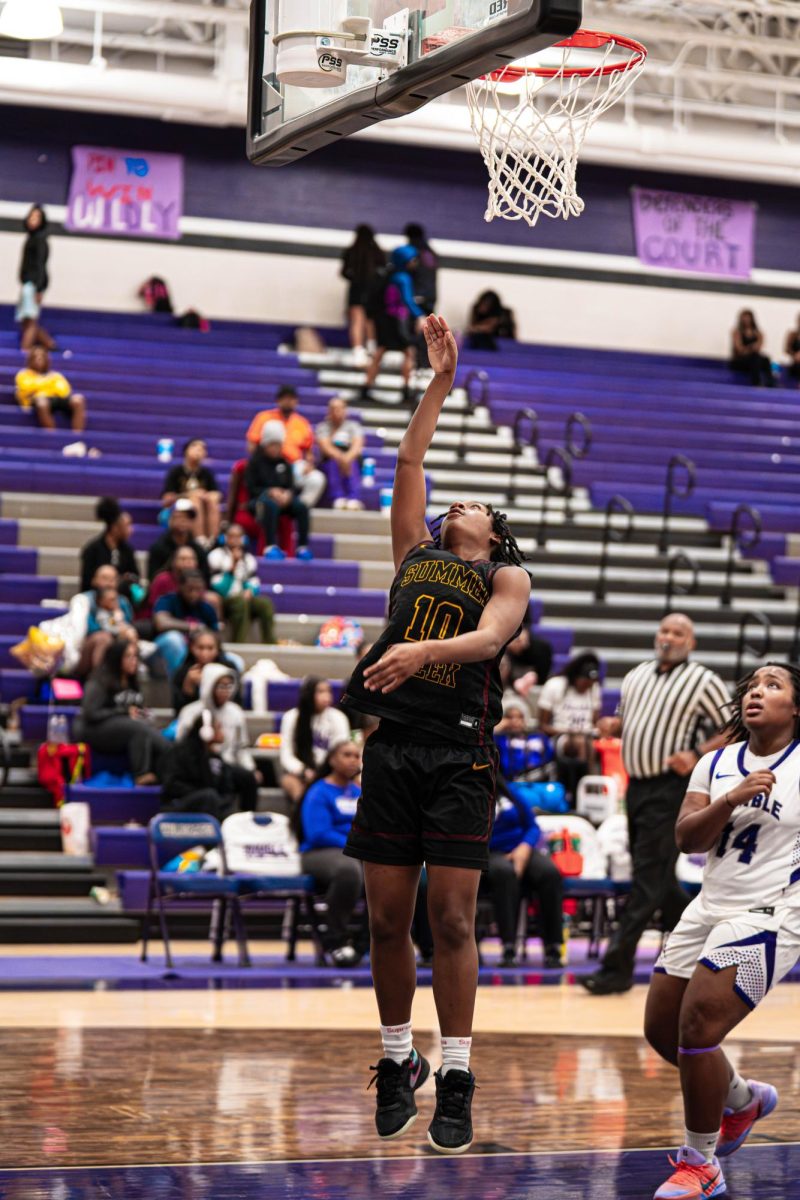 After a fast break, sophomore Ty'asia Young scores a lay-up.